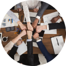 LogiQuad Solutions - team joining hands over a desk of paperwork